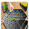 A hand is placing colored triangles onto a black board game for a chain game strategy battle.