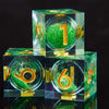 A set of green resin dice cubes with golden Elven numbers, featuring the number one.