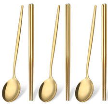 A set of six gold-toned stainless steel chopsticks and spoons for Korean dinnerware.