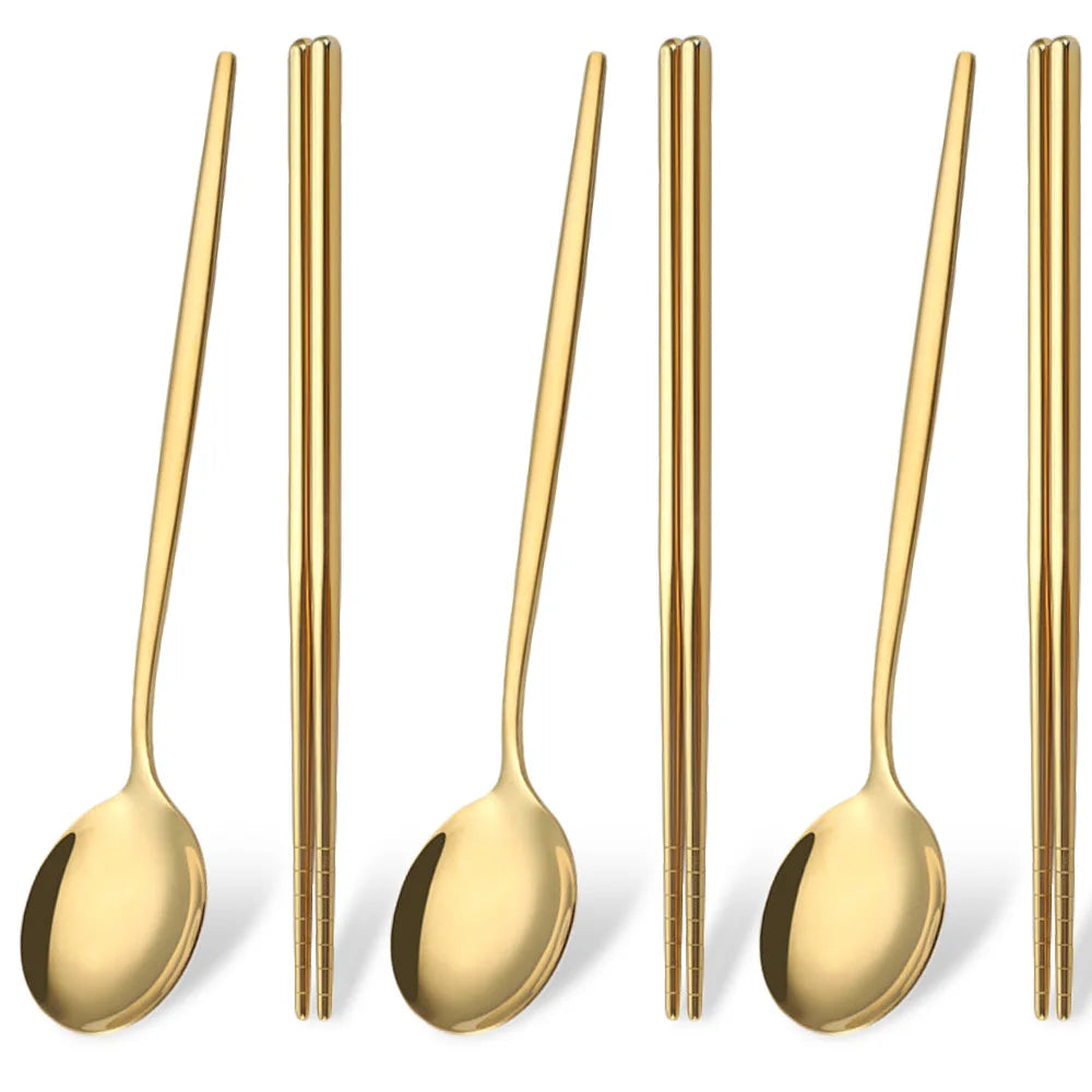 A set of six gold-toned stainless steel chopsticks and spoons for Korean dinnerware.