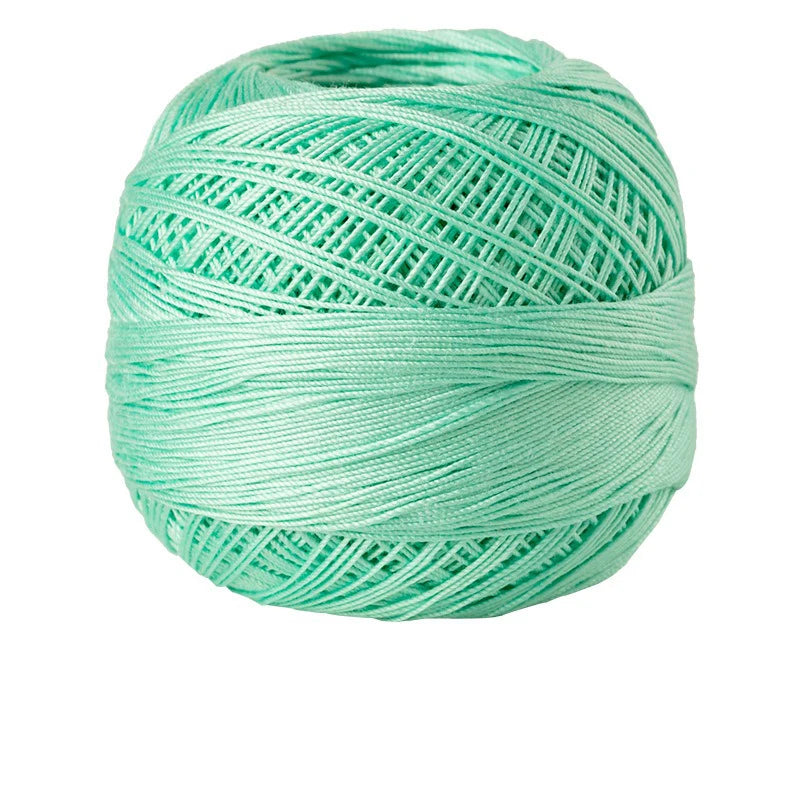 A ball of bright mint green 100% cotton crochet thread for tatting and embroidery.