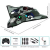 A green and black EPP foam stunt glider with LED lights, along with its remote control unit, instruction sheet, spare fan bla