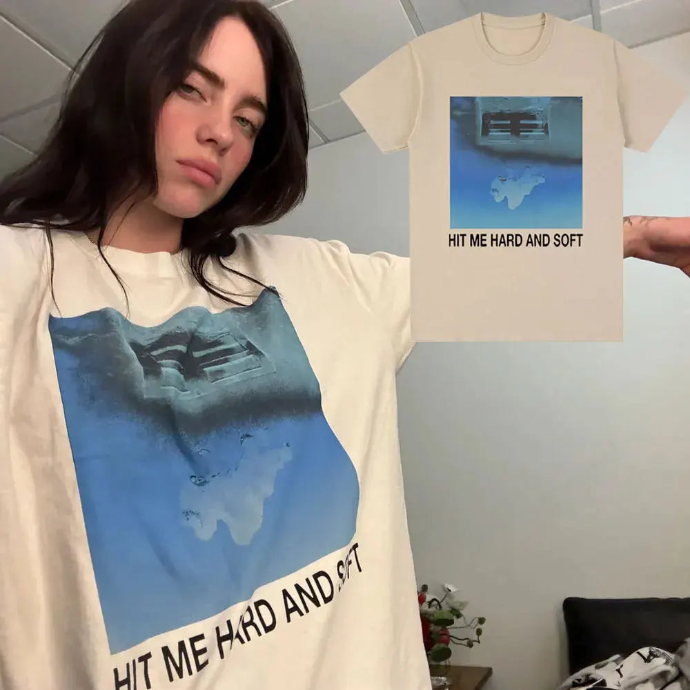 A model wearing a white t-shirt featuring a blue map design and the text Hit Me Hard and Soft
