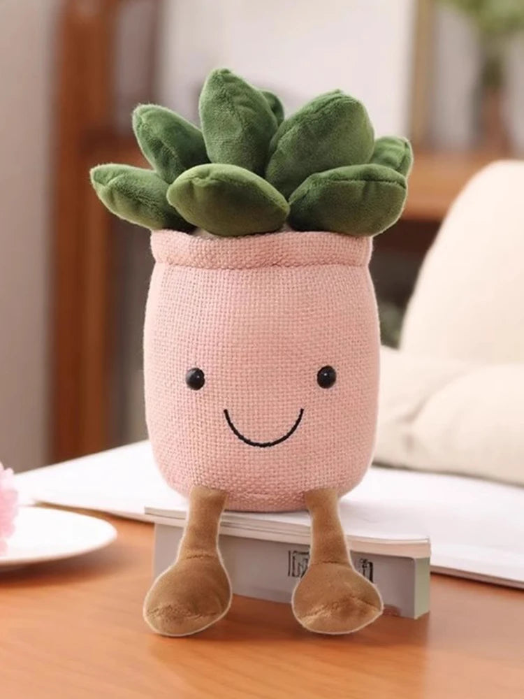 A pink knitted plush toy shaped like a small plant with green leaves and brown feet.