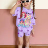 A young girl wearing a purple t-shirt and shorts with K-Pop and singing time graphics, standing against a pink wall.