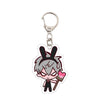 Acrylic keychain featuring an anime character with gray hair and bunny ears, holding a sign for a cafe.