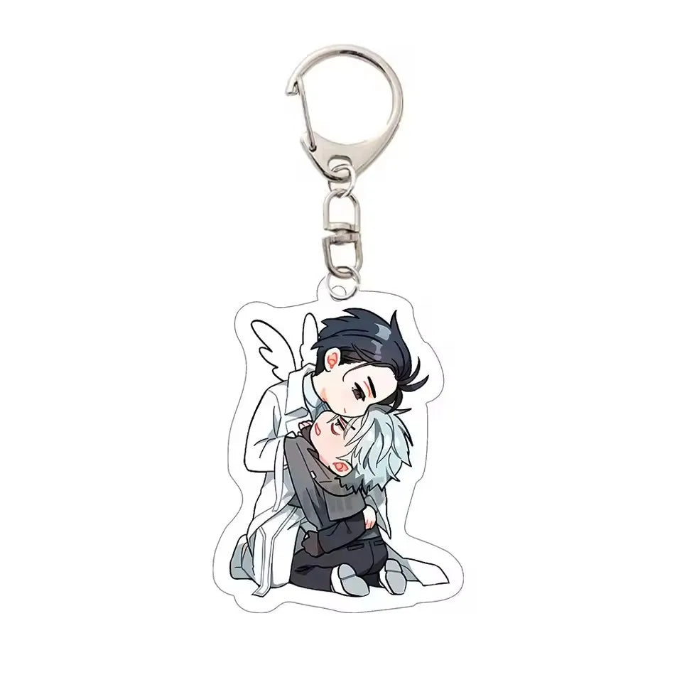 Anime character acrylic keychain featuring a male character with dark hair and white hair in a dynamic pose