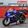 A blue Yamaha YZF-R1 Easy Rider die-cast motorcycle model in 1:18 scale displayed against a red background.