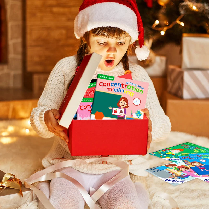A young child wearing a Santa hat is looking at a red sticker book with animal scenes and learning activities.