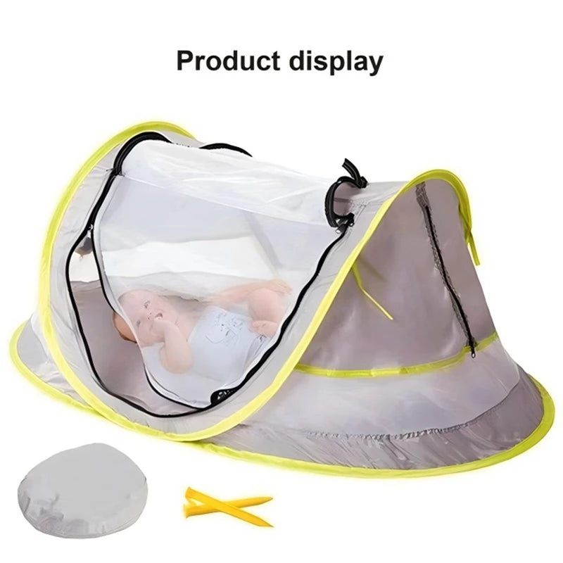 A light gray instant pop-up baby tent with a clear mesh canopy and yellow trim, shown open for display.