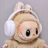 Labubu doll wearing a beige bear hoodie and white headphones