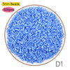 A pile of 5mm blue beads, packaged in a 500 piece count, for crafting and pixel art projects.