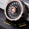 A close-up of a rose gold metal roulette fidget spinner with numbered sides resting on a black leather surface.