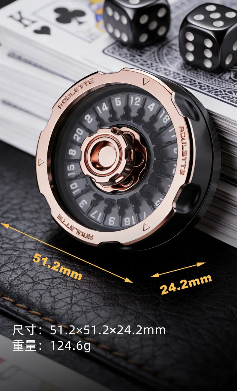 A close-up of a rose gold metal roulette fidget spinner with numbered sides resting on a black leather surface.