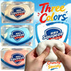 Three colors of squeezable squishy stress balls shown in packaging and being squeezed by hands