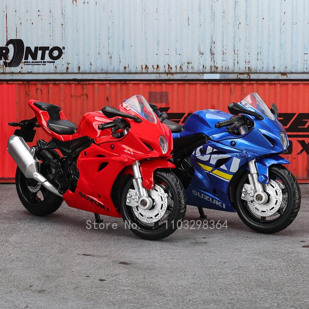 A red and blue 1:18 scale die-cast motorcycle model displayed in an outdoor setting.