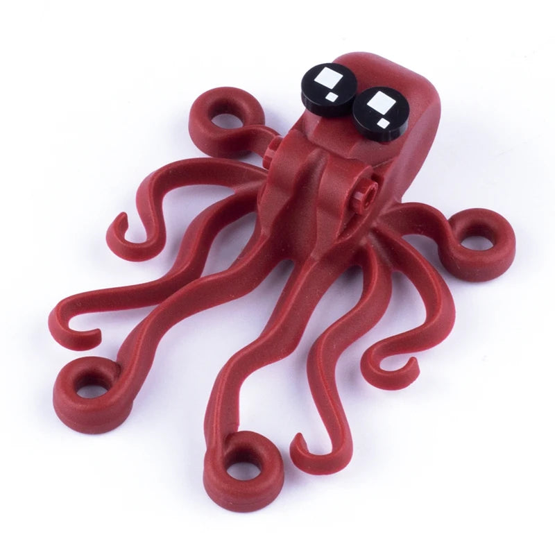 A red plastic marine animal building block set featuring a shark or octopus figure.