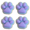 Four pastel purple cat paw squishy toys made of soft mochi material