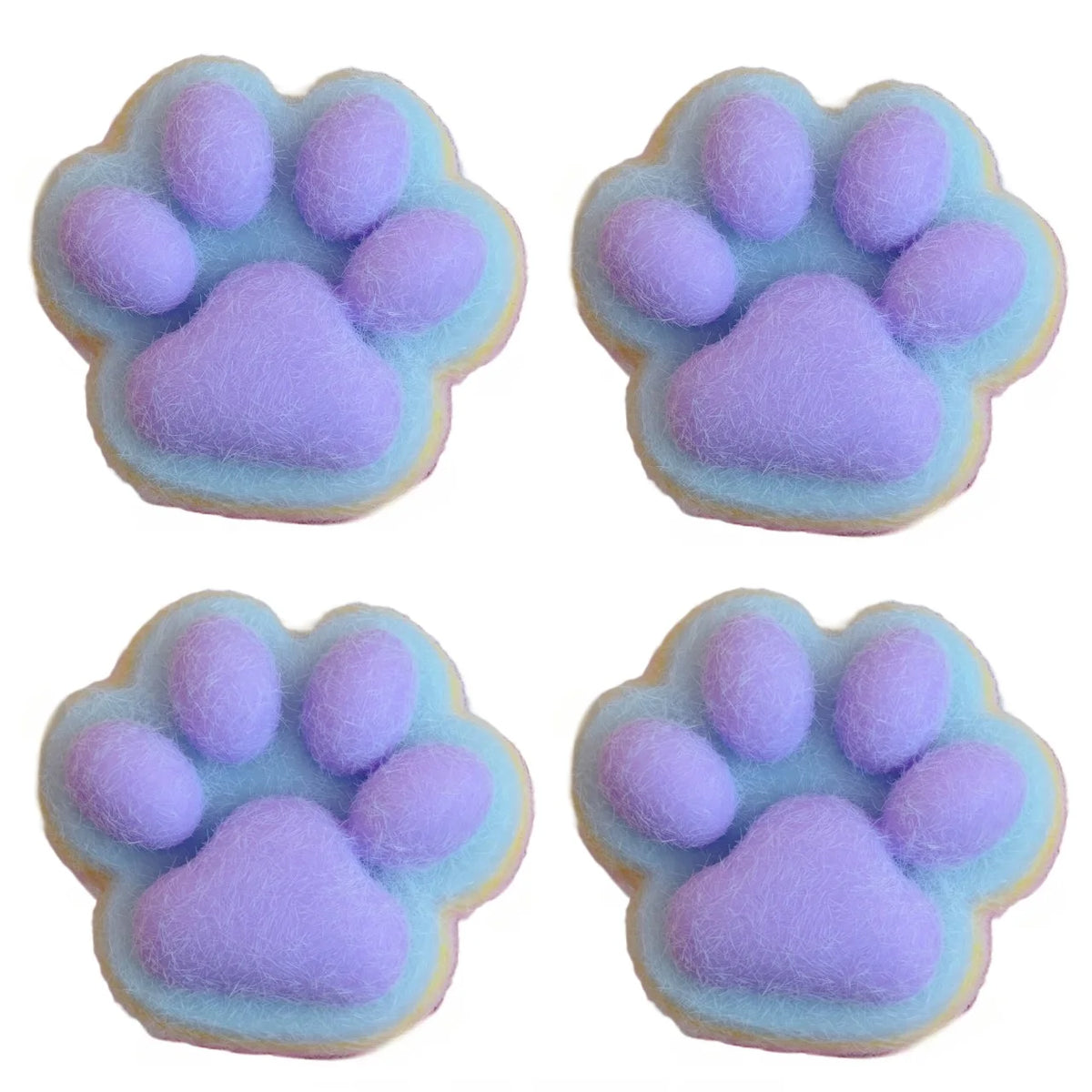 Four pastel purple cat paw squishy toys made of soft mochi material