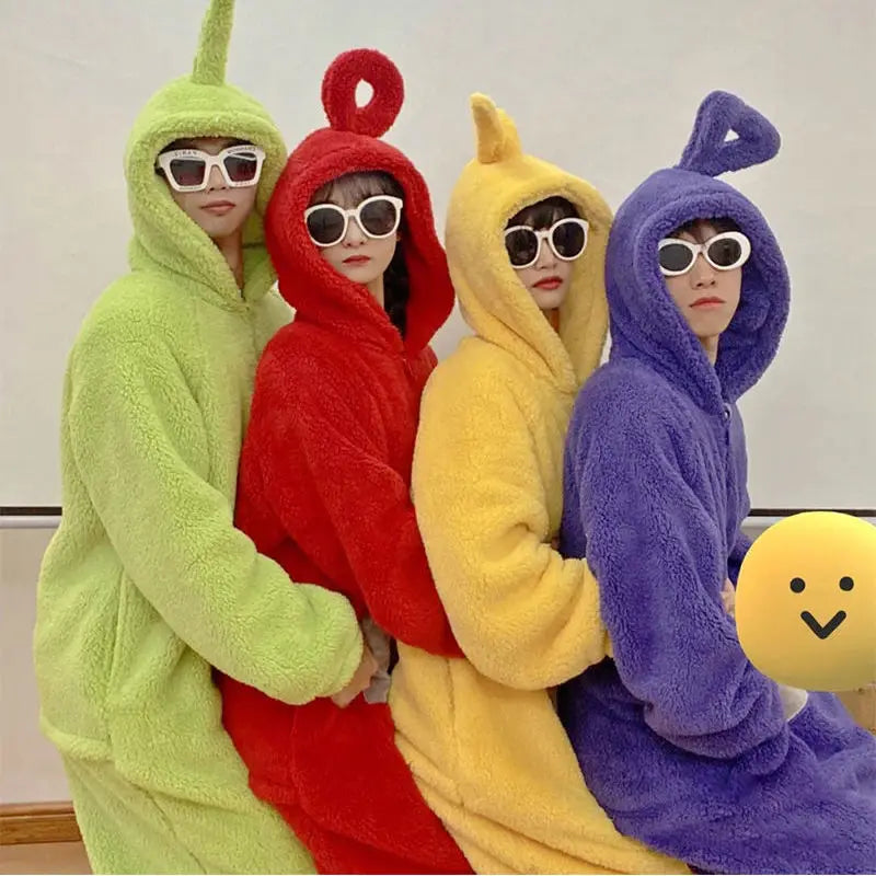 Four people wearing colorful, hooded pajamas inspired by Teletubbies characters