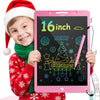 A smiling child wearing a red sweater and green scarf holds a pink 16-inch LCD writing tablet decorated with Christmas themes