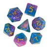 A set of colorful polyhedral dice including a d10, d6, and d20 made of glitter resin.