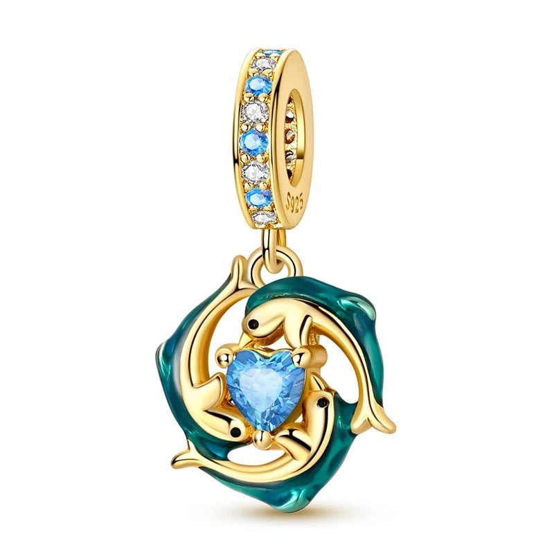 Sterling silver charm pendant set featuring starfish, sea turtle, and whale shark in teal and gold.