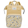 A beige mommy backpack with a patterned fabric featuring black and white panda faces.