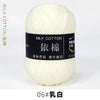 A ball of white milk cotton yarn labeled 06# White.