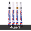 A set of eight permanent paint markers in various colors, including white and blue, standing upright.