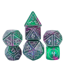 A set of seven resin polyhedral dice in various sizes and colors, including a pyramid die and a cube.