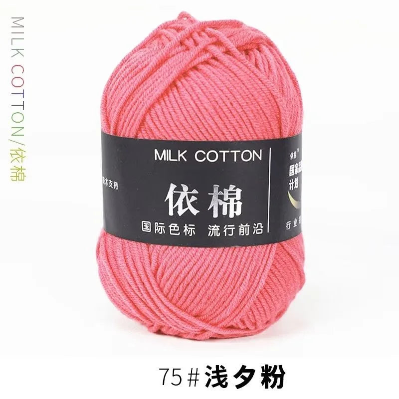 A ball of pink milk cotton yarn labeled with Chinese characters and a thread count of 75