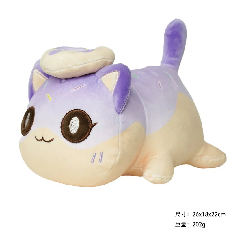 A purple and cream plush cat doll with large eyes and a small food accessory on its head.