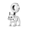 A sterling silver charm bead shaped like a dog's head is shown against a white background.