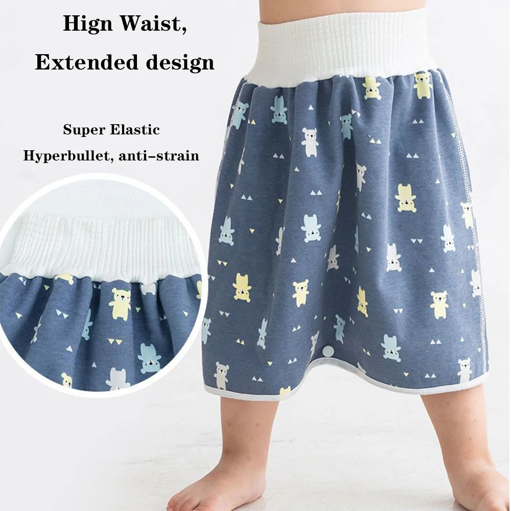 A child wearing blue patterned waterproof diaper pants with a high waist and extended design.