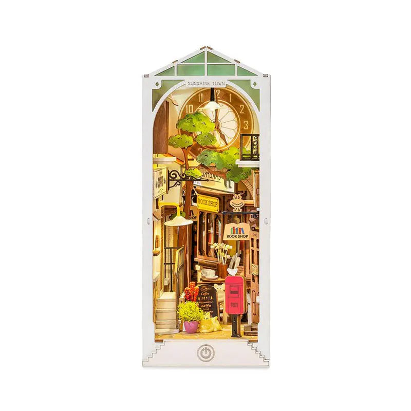 A miniature dollhouse kit featuring a shop facade with an arched window and a tree, designed for DIY building.