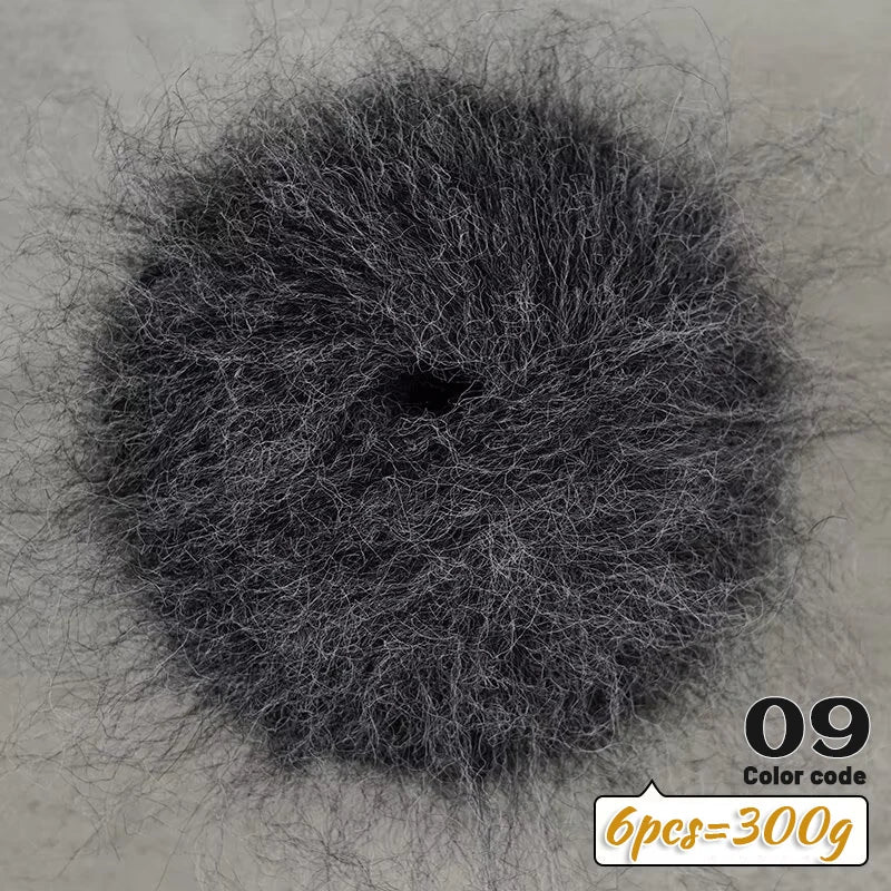 A circular pile of black long-haired alpaca blend yarn with a label indicating 9 balls weigh 300g.