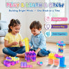 A child is building structures with colorful plastic blocks, demonstrating hand-eye and color cognition skills.