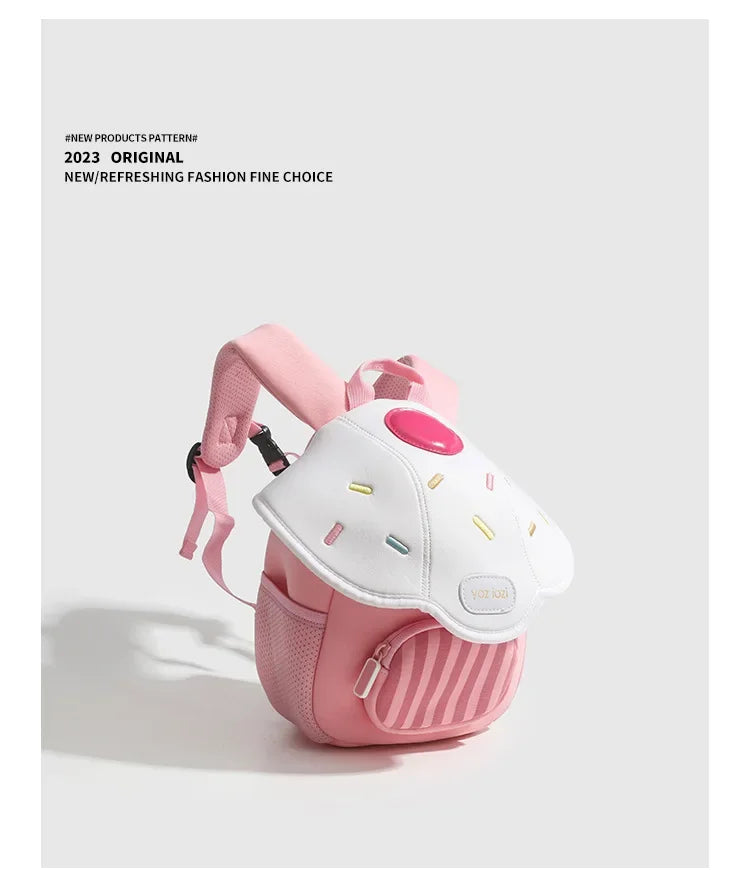 A pink mini backpack with a mushroom design and yellow accents, featuring a striped fabric section.