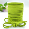A roll of bright lime green velvet faux suede braided ribbon for crafting and gift wrapping.