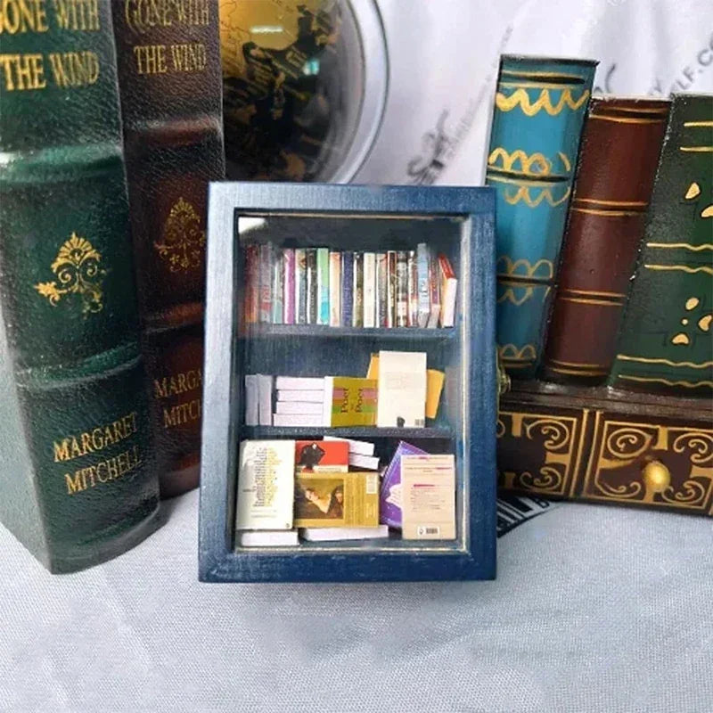 A wooden miniature bookshelf ornament displaying various small books and decorative spines.