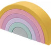 A rainbow arc of soft silicone building blocks in pastel colors, showing a gentle curve.