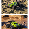 A yellow and black remote control off-road car with large tires is shown in a muddy water environment.