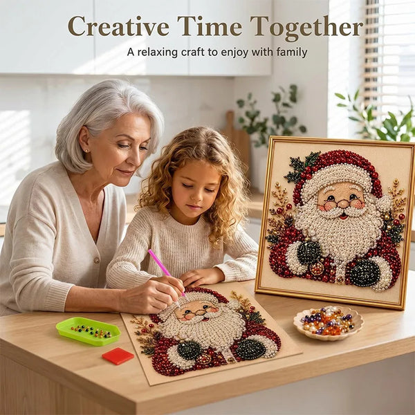 An elderly woman and a young girl are painting a Christmas Santa figure using pearl and diamond beads on a canvas.
