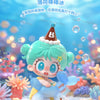 A cute baby figurine with light blue hair and a brown party hat sitting on a white surface.