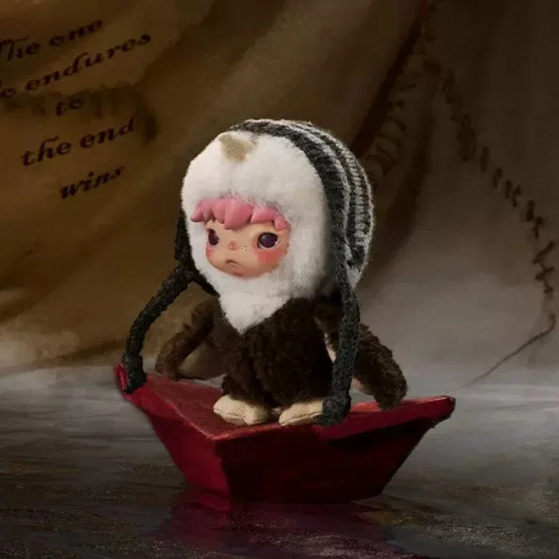 A small plush doll with pink hair and white fur is placed on a red dish against a beige background.