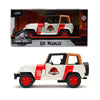 A diecast model of a white and red Jeep Wrangler toy vehicle featuring Jurassic Park branding.
