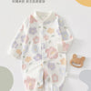 A white cotton long sleeve baby romper featuring a floral pattern of pink, purple, and yellow flowers.
