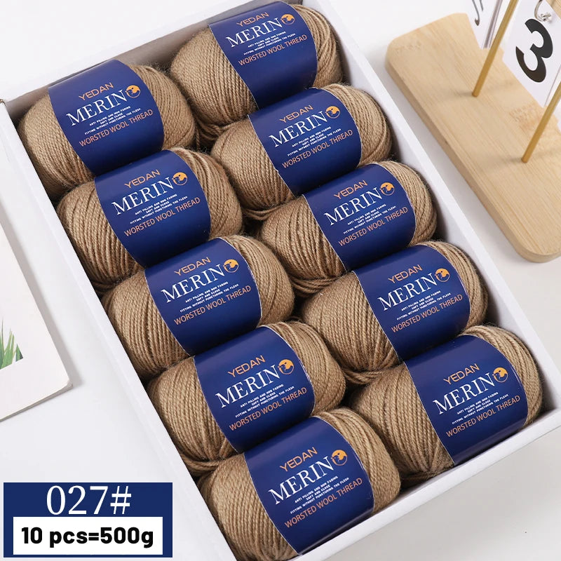 A box containing 10 balls of YEDAN MERIN worsted wool thread yarn for knitting projects.