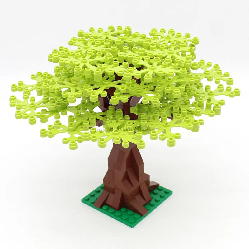 A model of a cherry blossom tree built from green interlocking plastic blocks with a brown trunk and green base.